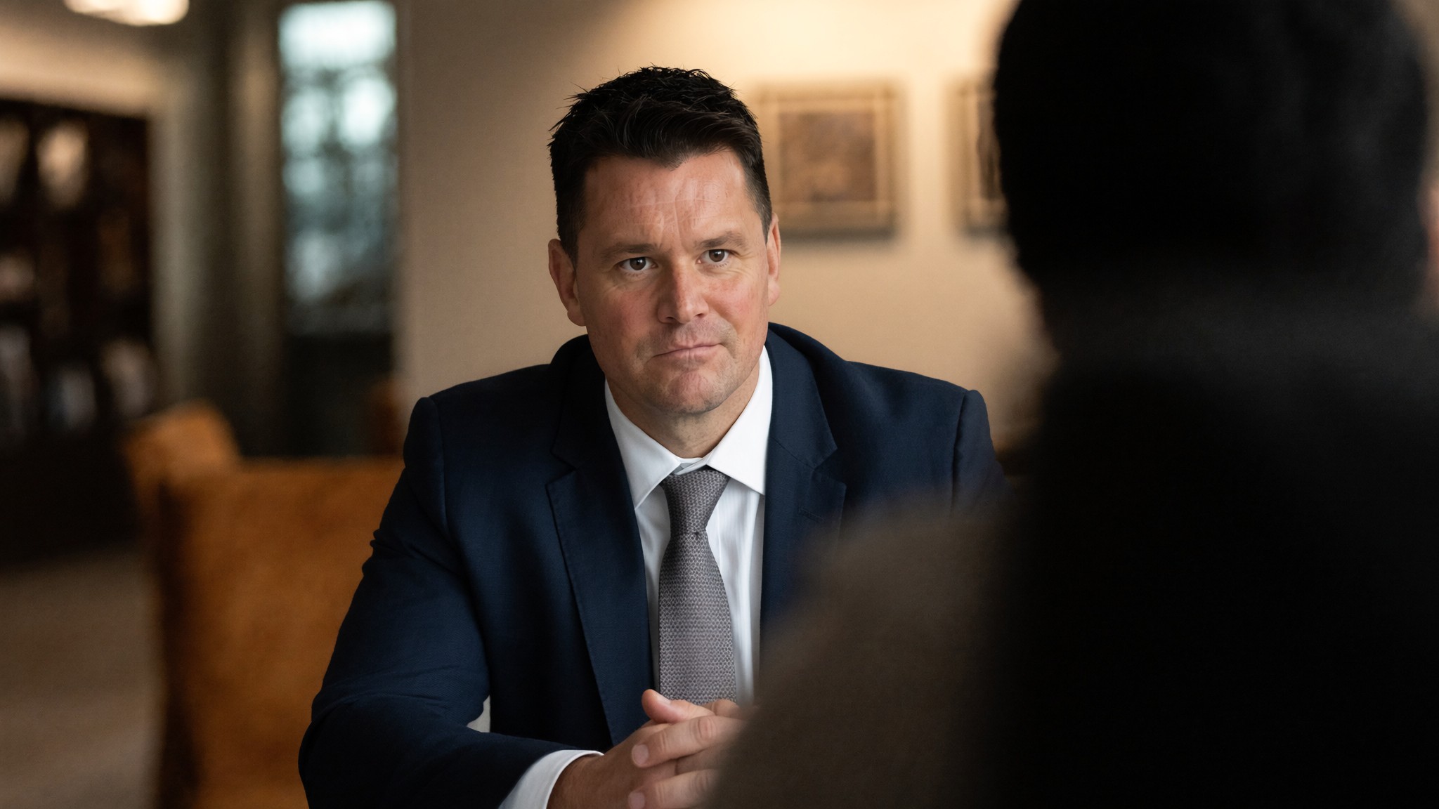 Robb MacDonald listening to a client in a private consultation